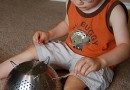 Keep a toddler busy with a colander